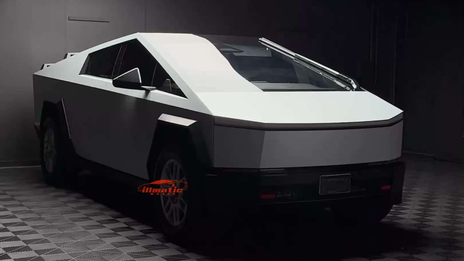 Rear three quarter view of a matte white wrapped Tesla Cybertruck in the Illmatic Wraps studio