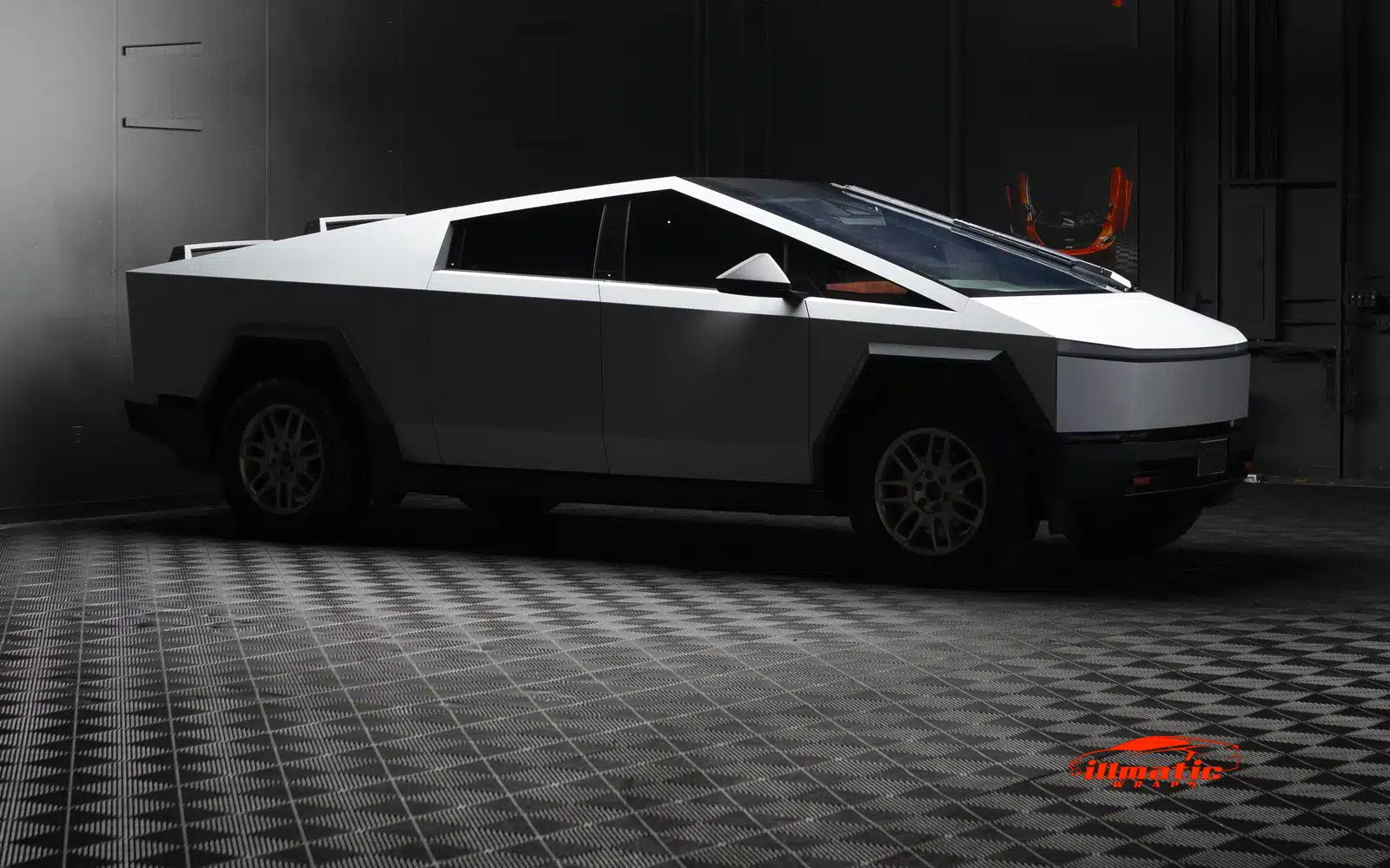 Satin white wrapped Tesla Cybertruck in the illmatic Wraps indoor bay